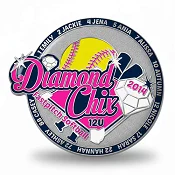 Custom trading pin for the Diamond Chix 12U fastpitch softball team, featuring a bright pink and yellow design with a softball, crossed bats, and multiple white gems. The outer ring lists player names, and “2014” is displayed on a sparkling diamond shape.