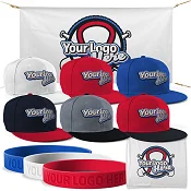 Assortment of customizable team merchandise including flat-brim hats in various colors, silicone wristbands, a white rally towel, and a banner, all featuring a placeholder design labeled “Your Logo Here.” Items are designed for team branding, spirit wear, or promotional use.
