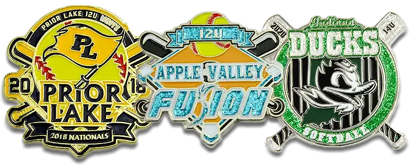 Three custom softball trading pins featuring teams from Prior Lake, Apple Valley, and the Oakland Ducks. The Prior Lake pin includes crossed bats, a yellow flag, and the year 2018 Nationals. The Apple Valley Fusion pin features a sparkling blue design with a softball and bats. The Oakland Ducks pin shows a fierce duck mascot with green glitter accents and striped background.