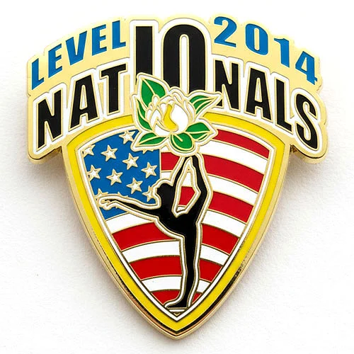 Custom trading pin for the 2014 Level 10 Nationals, featuring a shield with the American flag and a gymnast silhouette in a scorpion pose. The top of the pin displays bold text reading “Level 10 2014 Nationals” with a white and yellow magnolia flower at the center.