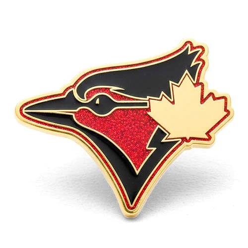 Red and black custom trading pin with bird head design and gold maple leaf. Custom trading pin featuring a stylized red and black bird head outlined in gold with a red glitter background, resembling a jay. A gold maple leaf overlays the design, symbolizing Canadian pride.