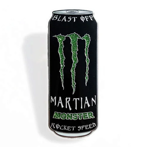 Custom trading pin shaped like an energy drink can, featuring a glittery green claw logo and stylized text that reads “Blast Off,” “Martian Monster,” and “Rocket Speed.” The design mimics the look of a Monster Energy drink can.