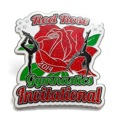 Custom trading pin for the 2014 Red Rose Gymnastics Invitational, featuring a large red glitter rose in the background with two gymnast silhouettes performing poses on either side. The text includes “Red Rose,” “Gymnastics,” and “Invitational” in red and green with star accents.