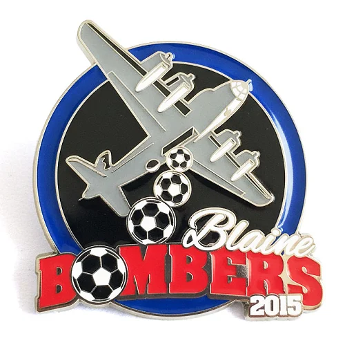 Custom trading pin for the Blaine Blitz USA soccer team, shaped like a shield and featuring a bold black and white soccer ball with blue glitter flames behind it. The top of the design includes the year “2013” in a silver banner.